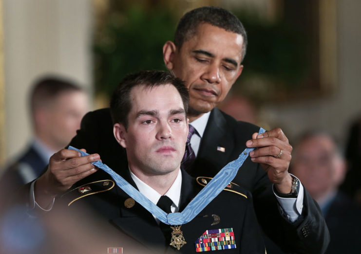 Barack Obama placing the Medal of Honor around Clinton Romesha's neck