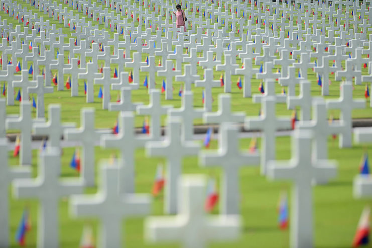 Woman visiting graves at the Manila American Cemetery