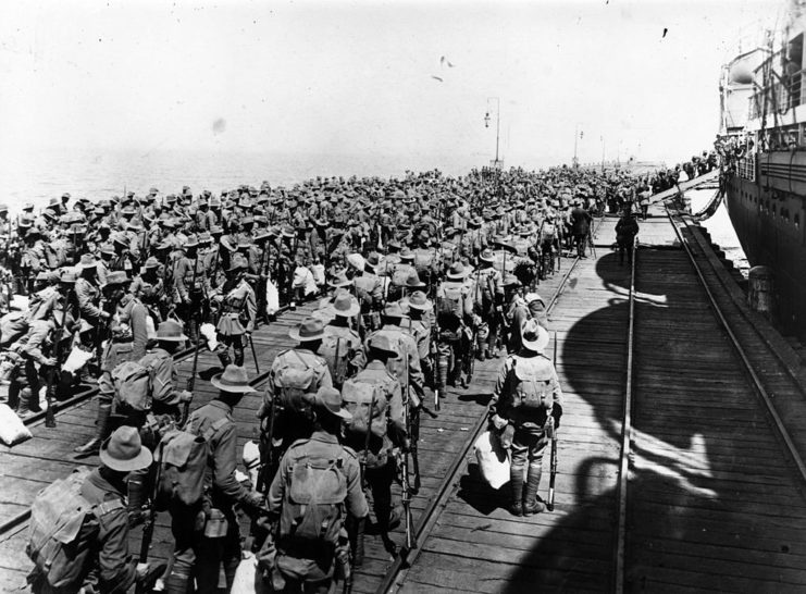 Australian soldiers standing on a dock
