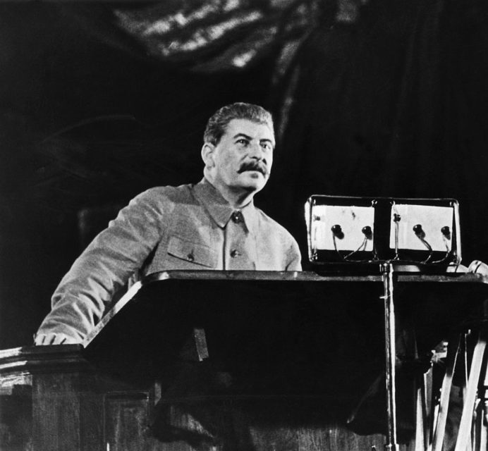 Joseph Stalin standing at a podium