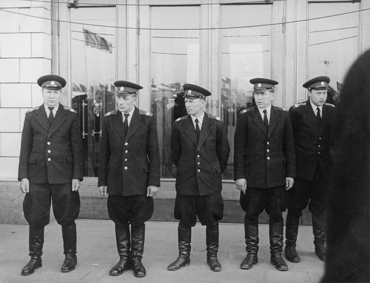 Five Russian police officers standing outside a building