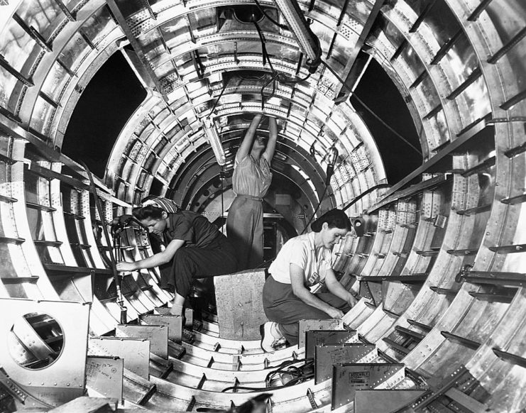 Three female workers assembling a Boeing B-17F Flying Fortress tail fuselage