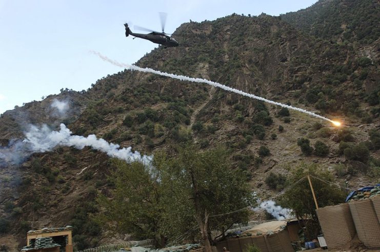 Supply helicopter firing anti-missile devices from the air