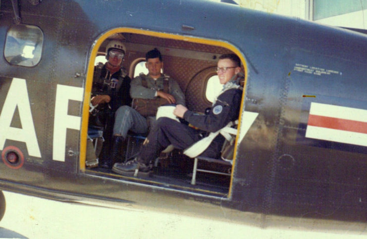 Michael Stahl sitting in a De Havilland U1-A Otter with two comrades