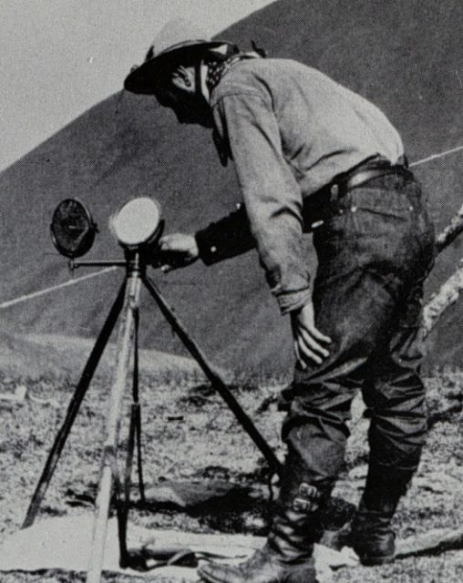 Man operating a heliograph outside