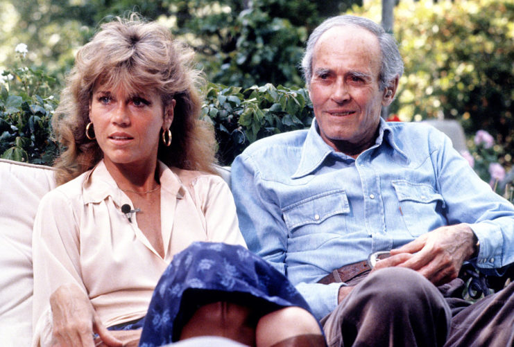 Jane Fonda sitting with Henry Fonda