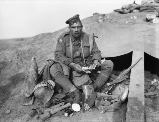 John Hines sitting among stolen German equipment