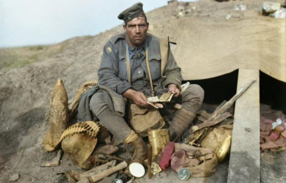 John Hines sitting among stolen German equipment