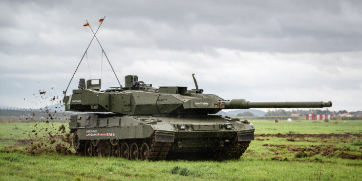 Leopard 2A7 driving through a field