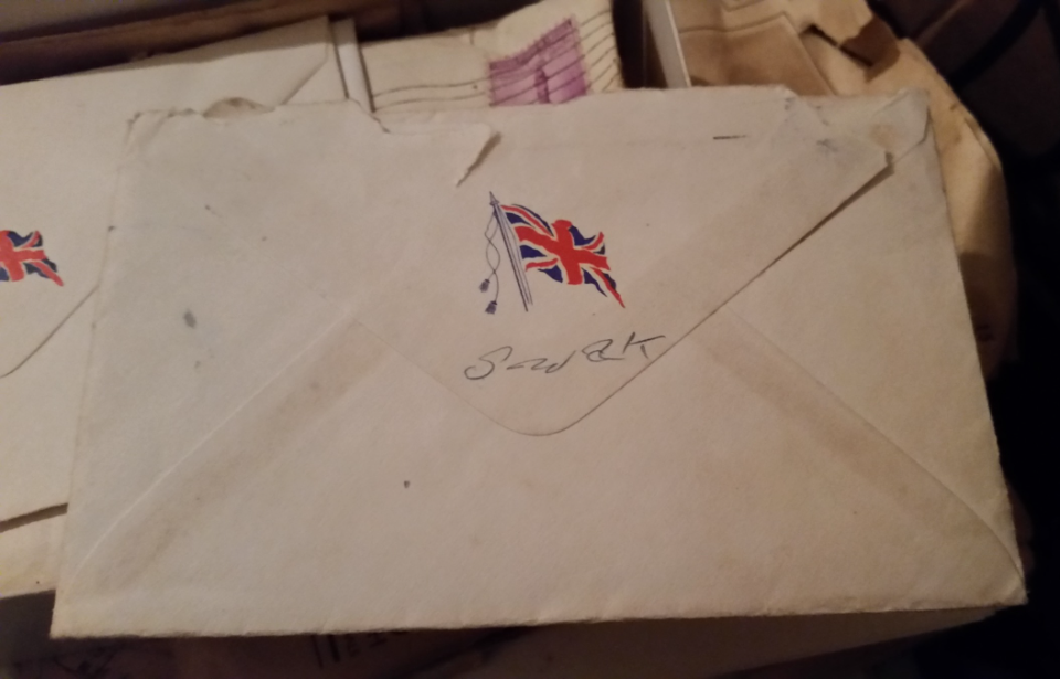Envelope with "SWA(L)K" written in pencil on the back