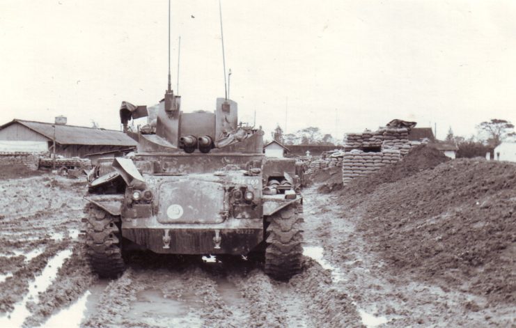 M42 Duster parked on a muddy road