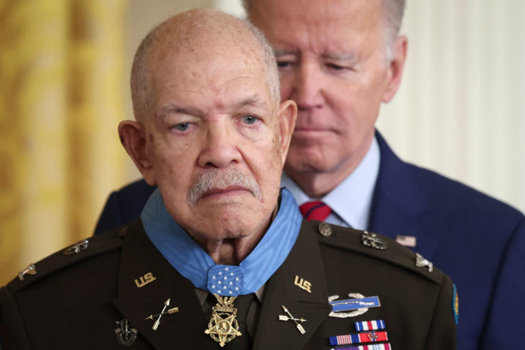 Joe Biden placing the Medal of Honor around Paris Davis' neck