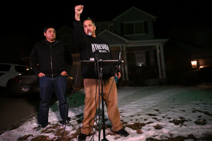 Ed and Rich Fierro standing in front of microphones