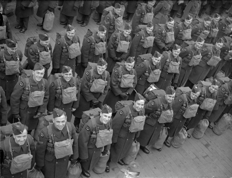 Members of the Royal Canadian Air Force standing together in uniform