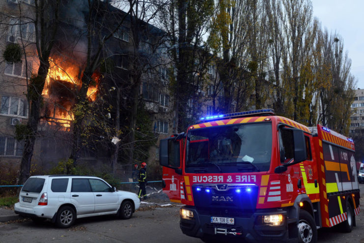 Flames erupting from an apartment building