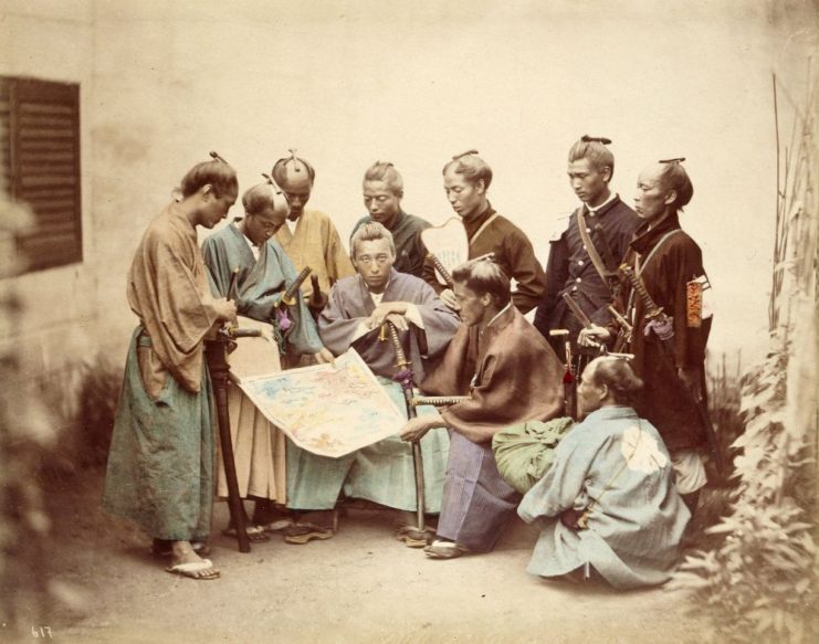 Ten samurai looking at a map