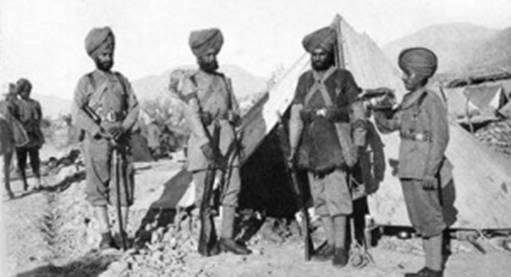 Four Sikh soldiers standing in front of a tent