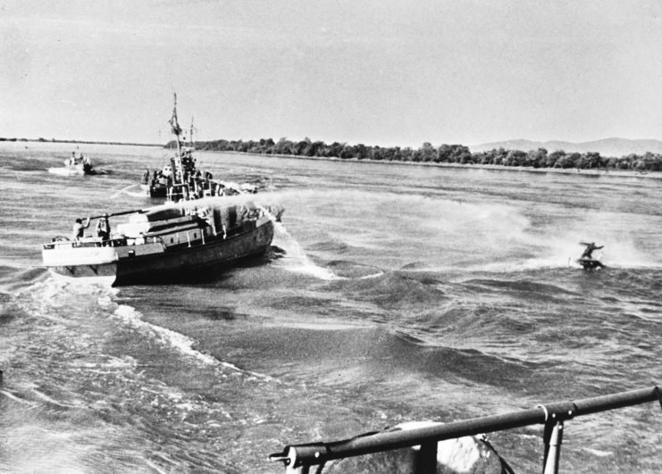 Soviet vessel spraying its water cannon at a Chinese fishing boat