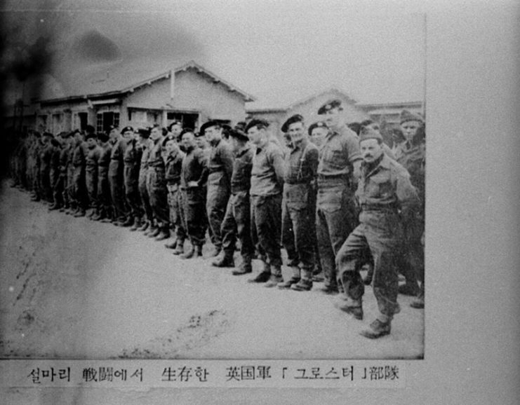 Members of the "Glorious Glosters" standing in a line