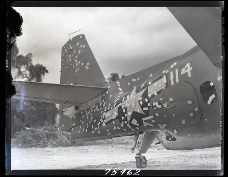 Torpedo bomber with shrapnel damage toward the tail section