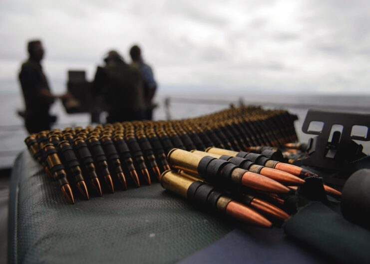 .50 caliber BMG cartridge belts laid out