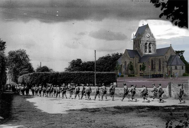 Members of the 82nd Airborne Division walking through Saint-Mère-Église