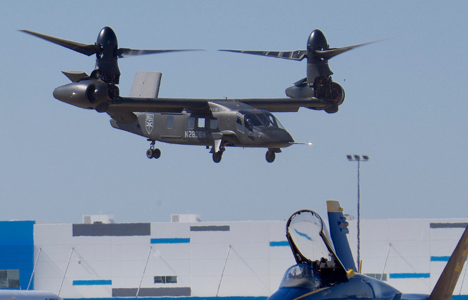 Bell V-280 Valor hovering over a grounded aircraft