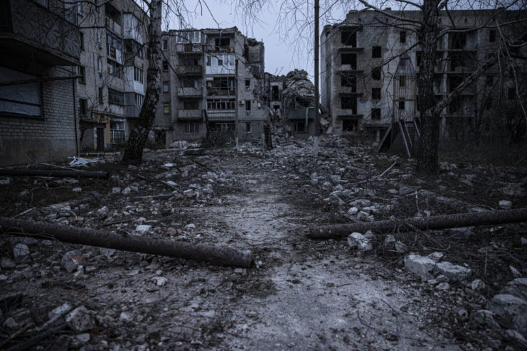 Damaged apartment buildings at dusk