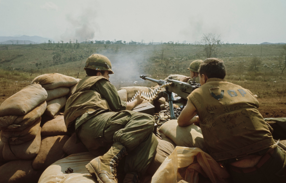 Three soldiers manning an M2 Browning .50 caliber heavy machine gun