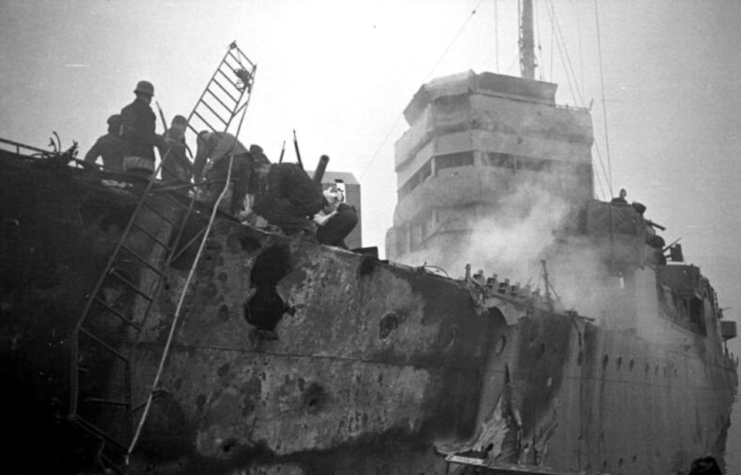 German soldiers aboard the smouldering wreck of the HMS Campbeltown (I42)