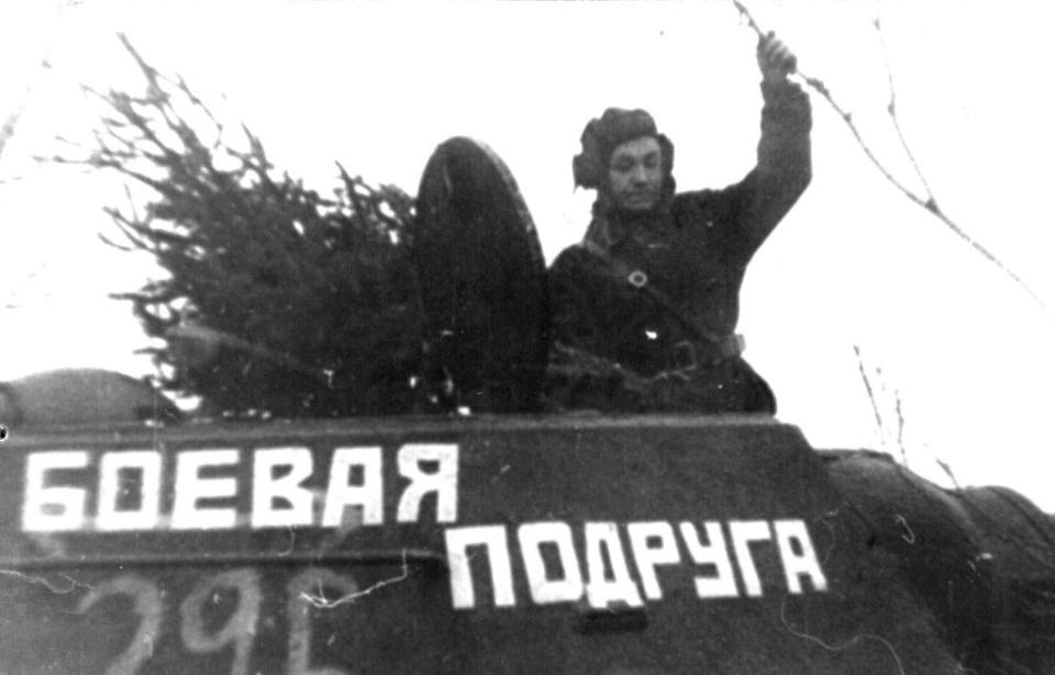 Mariya Oktyabrskaya standing in the hatch of a T-34
