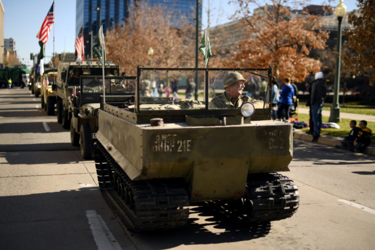 Convoy of M29 Weasels driving down a city street