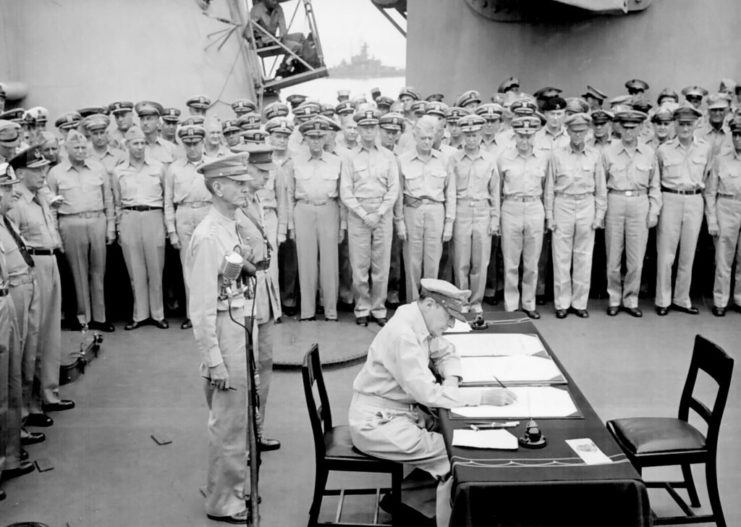 Sailors watching Douglas MacArthur sign the Japanese Instrument of Surrender