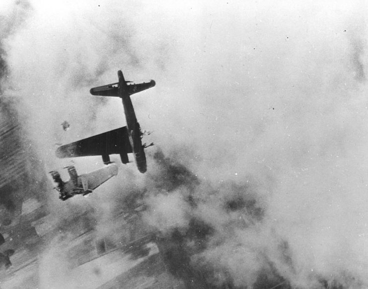 Aerial view of a Boeing B-17 Flying Fortress with its wing shot off