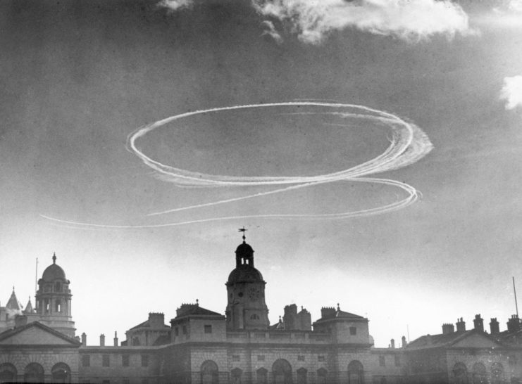 Aircraft exhaust clouds over multiple buildings