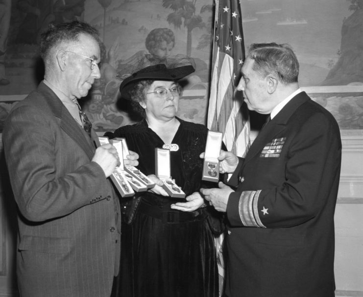 Thomas and Alleta Sullivan standing with Clark H. Woodward