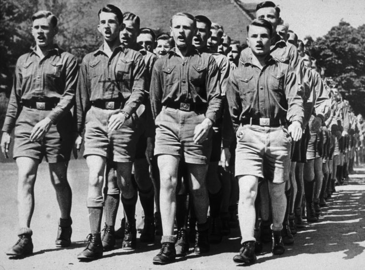 Young men marching in formation