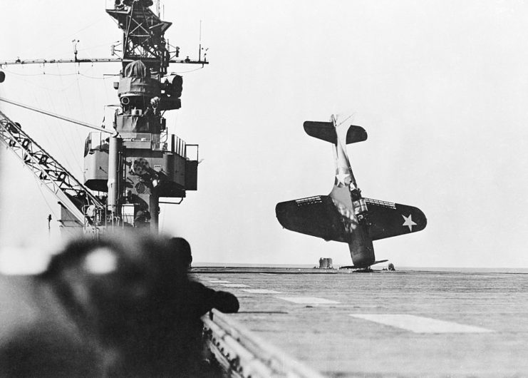 Douglas SBD Dauntless positioned nose first on the deck of an aircraft carrier