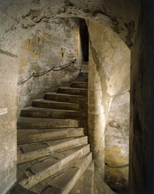 View of a spiral staircase within a medieval castle