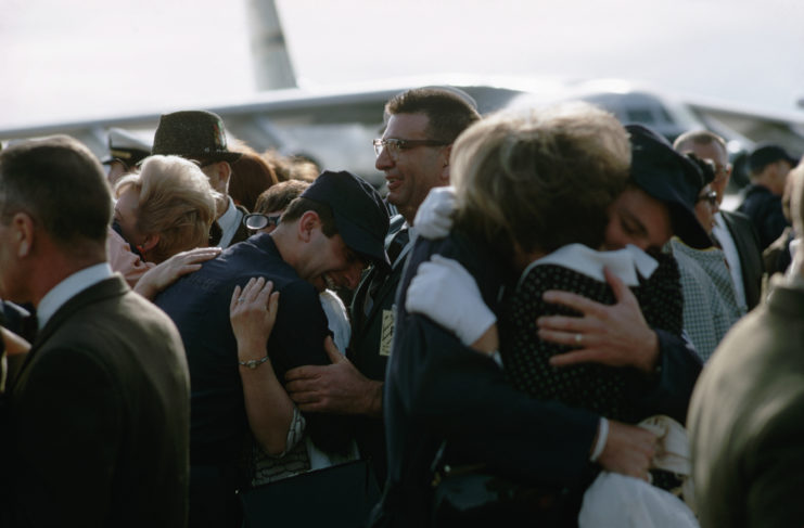 Crew members from the USS Pueblo (AGER-2) hugging their family members