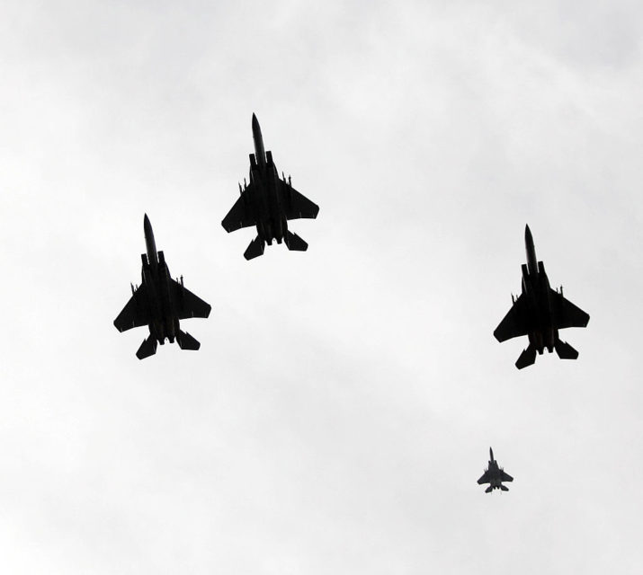 Four aircraft flying in a missing man formation