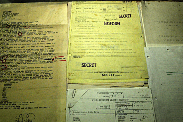 Top-secret documents from the USS Pueblo (AGER-2) laid out on a table