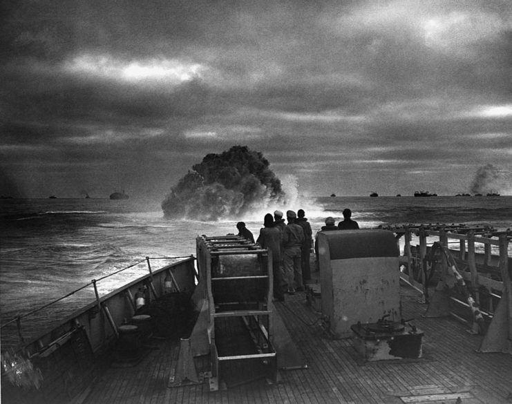 Sailors watching U-175 explode beneath the water