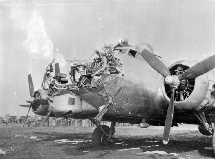Boeing B-17 Flying Fortress with extensive damage to its nose