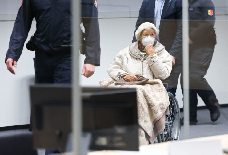 Irmard Furchner being wheeled into court by German police officers