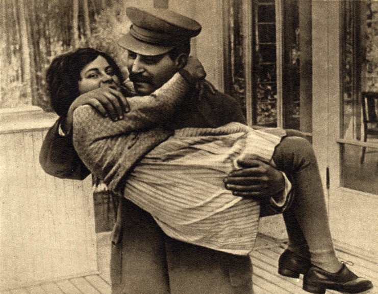 Joseph Stalin holding his daughter, Svetlana Alliluyeva, in his arms