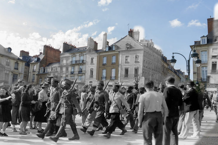 Soldiers marching along a street in Rennes