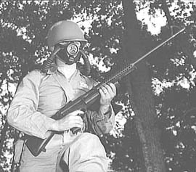 Soldier holding an M1941 Johnson light machine gun