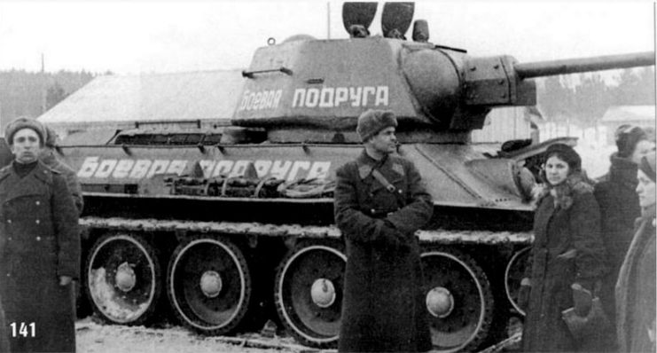 Mariya Oktyabrskaya and other Red Army soldiers standing beside the T-34 'Fighting Girlfriend'