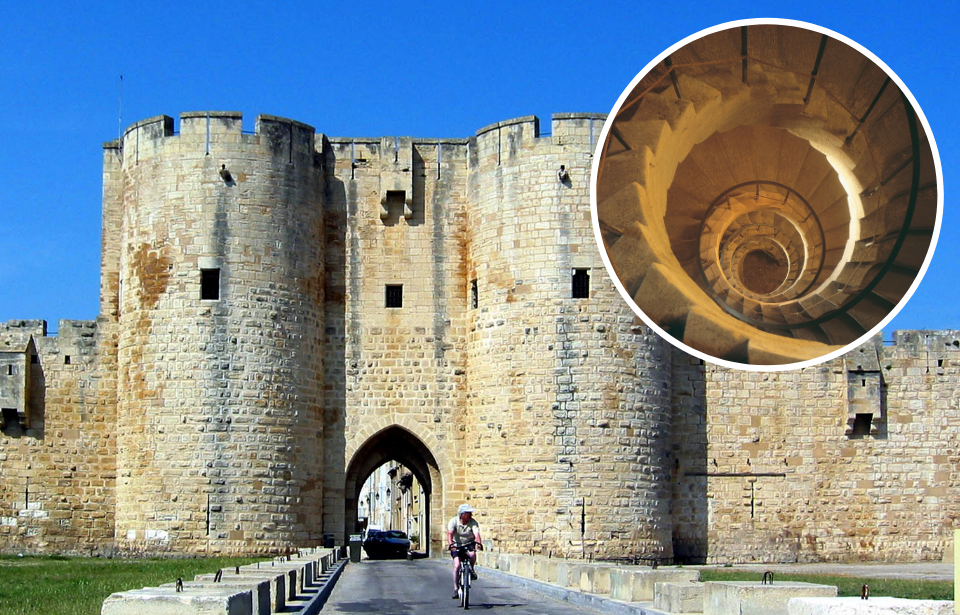 Individual biking away from a medieval castle + View of a spiral staircase in a medieval castle